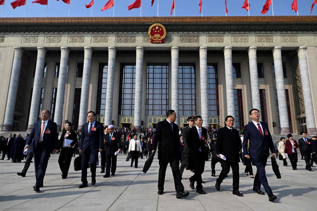 Delegates leave after the opening session of the National People’s Congress, in Beijing on Wednesday. The finance ministry has proposed an 8.4 per cent increase in the foreign policy budget. Photo: AFP
