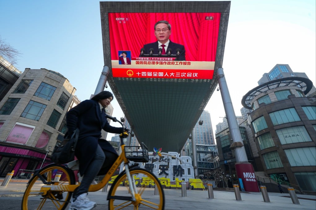 A screen at a shopping centre in Beijing shows Premier Li Qiang speaking during the opening of the annual session of China’s top legislature on Wednesday. Photo: Robert Ng
