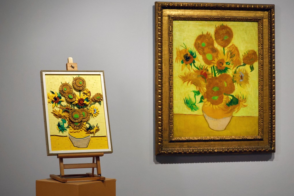 A Lego recreation of one of Vincent Van Gogh’s Sunflowers paintings on display next to the actual painting in the Van Gogh Museum in Amsterdam. Lego fans can buy a 2,615-piece brick set to take home and make their own Sunflowers. Photo: Reuters