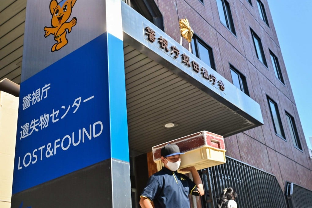A delivery man leaving the Tokyo Metropolitan Police Department Lost and Found Centre in the Iidabashi area of central Tokyo. Photo: AFP