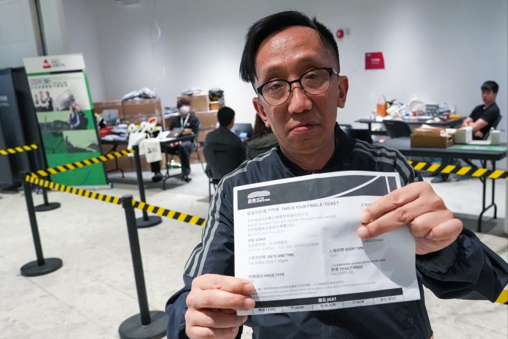 Henry Wo, one of the spectators at the World Grand Prix event on Tuesday, shows off his ticket. Photo: May Tse