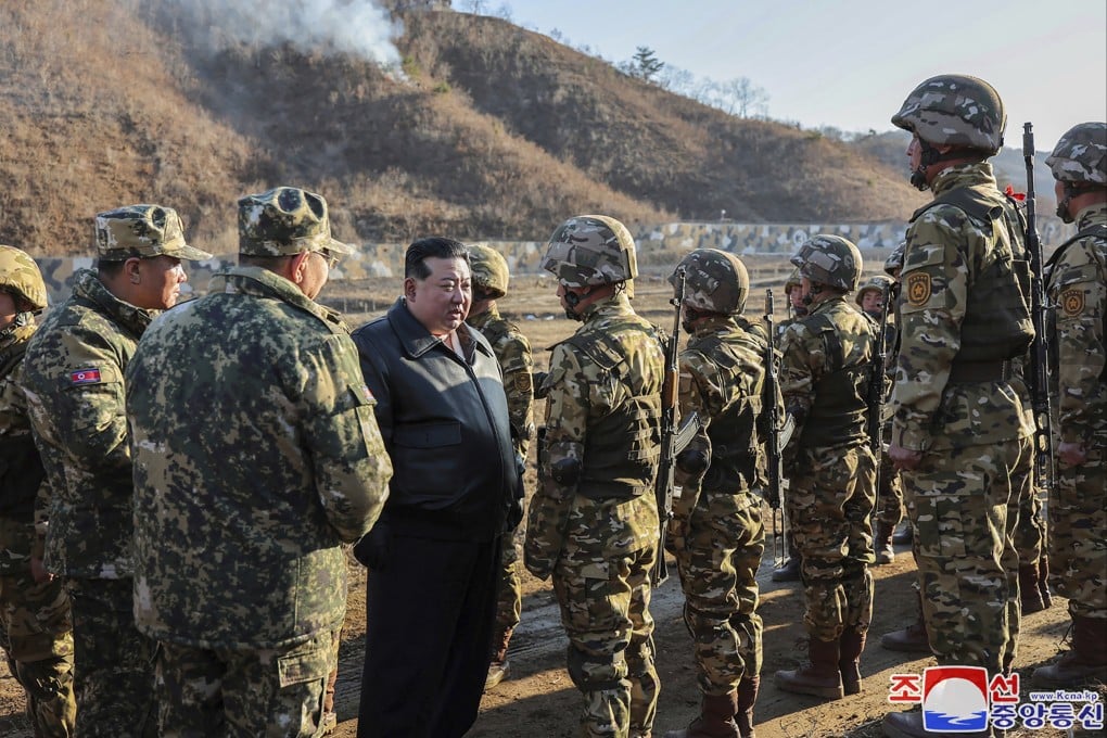 North Korean leader Kim Jong-un meets soldiers during a visit to a training base. Photo: AP