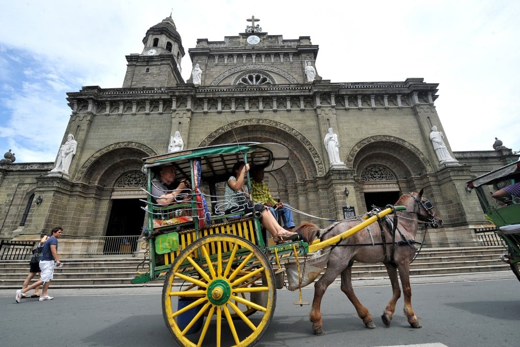 Tourists at the Manila Cathedral in Intramuros in Manila. Photo: AFP