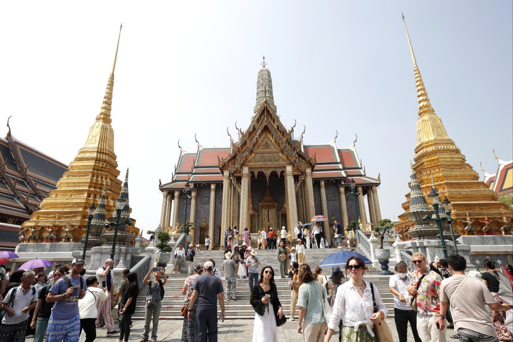 Tourists visit the Temple of the Emerald Buddha in Bangkok, Thailand. China is Thailand’s largest source of foreign visitors, and the Thai economy depends on the income they generate. Photo: EPA-EFE