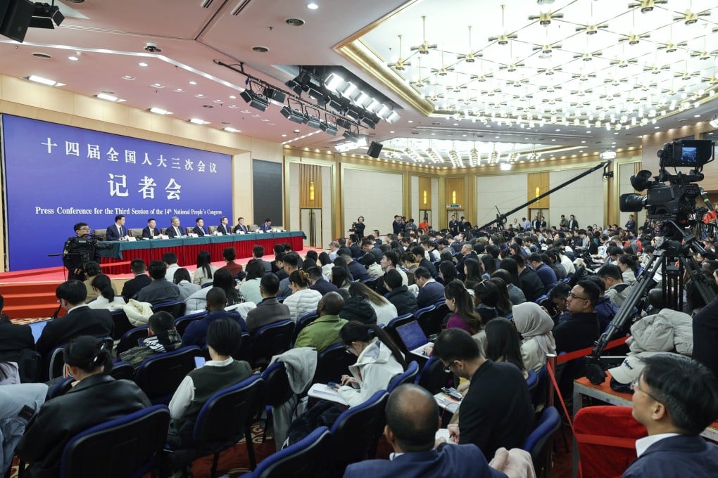 China’s top finance and economic officials address the media as part of the annual ‘two sessions’, in Beijing on Thursday. Photo: Xinhua