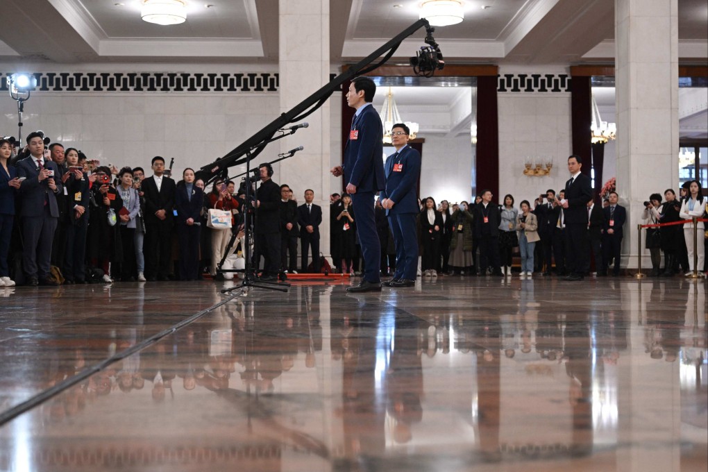 NPC deputy Lei Jun, the founder of Chinese electronics company Xiaomi, answers questions from journalists at the Great Hall of the People in Beijing on Wednesday. Photo: AFP