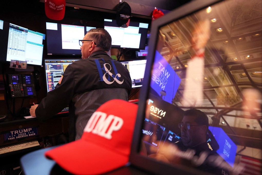 Traders work on the floor of the New York Stock Exchange during morning trading on March 4. Stocks continued a downward trend as the stock market opened a day after the S&P 500 posted its biggest daily loss since December at 1.8 per cent down, after US President Donald Trump’s tariffs on Canada, Mexico and China took effect. Photo: Getty Images via AFP