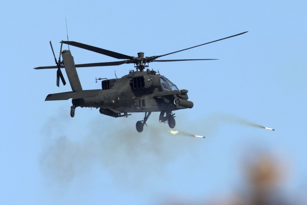 A South Korean army helicopter fires rockets during a military drill in Pocheon on Thursday. Photo: Yonhap via AP