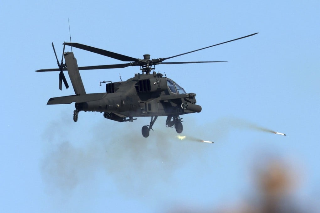 A South Korean army helicopter fires rockets during a military drill in Pocheon on Thursday. Photo: Yonhap via AP