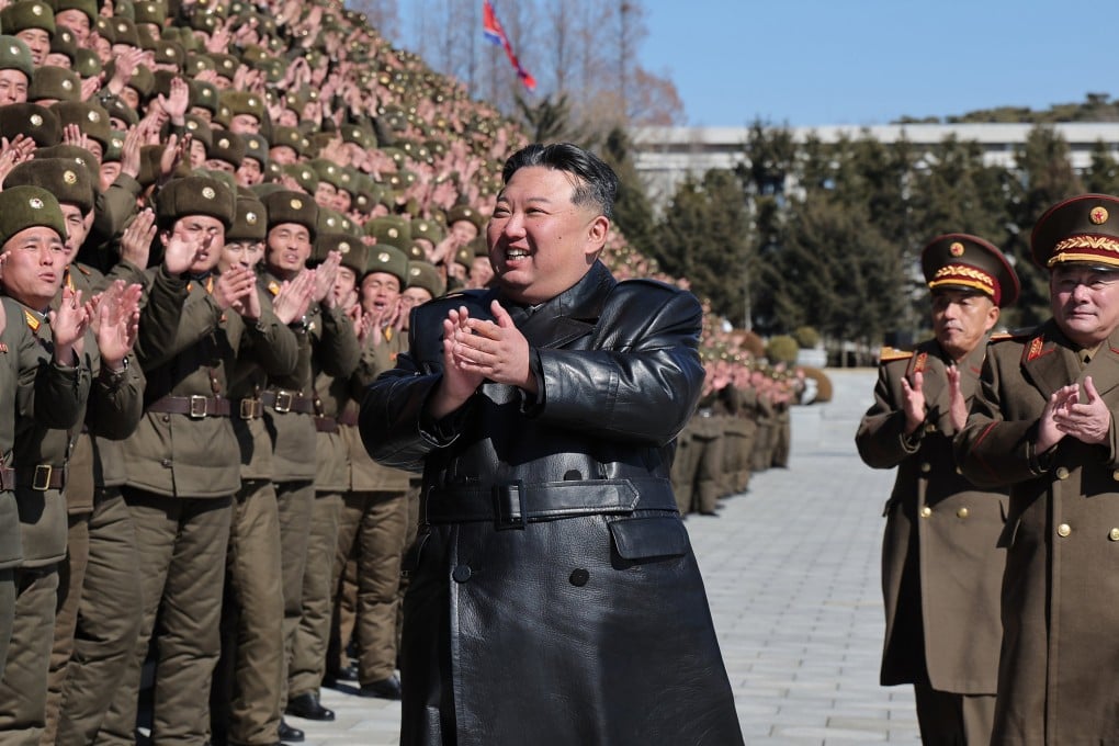 North Korean leader Kim Jong-un (centre) claps during a visit to a university in Pyongyang last month. Photo: KCNA/EPA-EFE