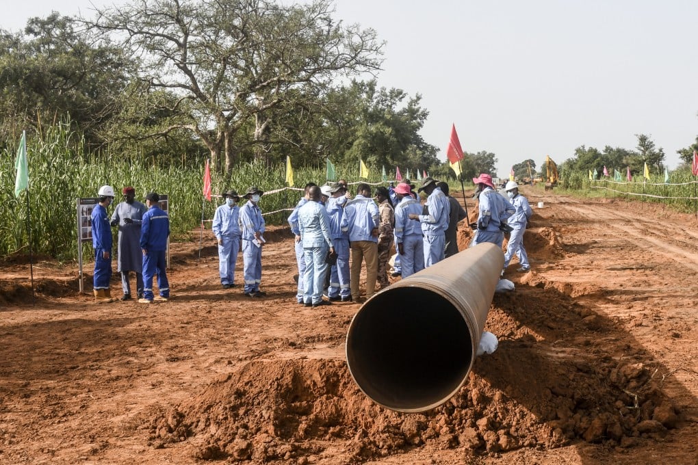 Workers from Niger and China work on an oil pipeline, one of the scores of Chinese-funded projects across the continent. Photo: AFP