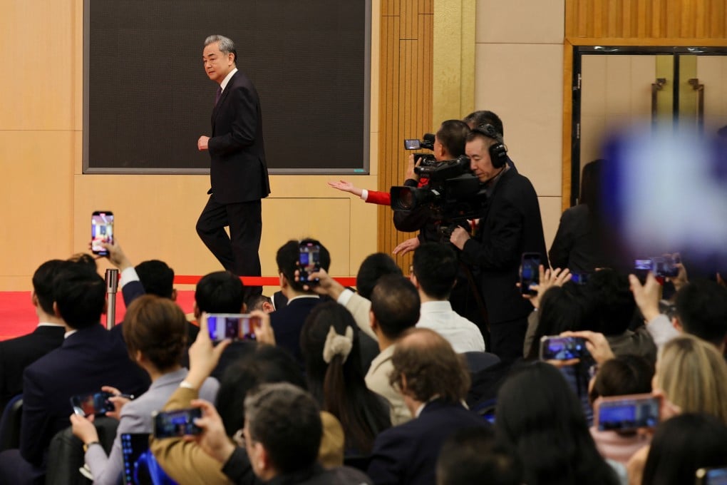 Chinese Foreign Minister Wang Yi arrives to lead a press conference on the sidelines of the “two sessions”, in Beijing on Friday. Photo: Reuters