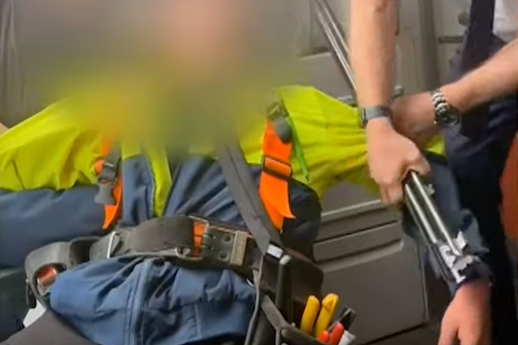 A screengrab shows the Australian teen being subdued after trying to sneak on board with a shotgun and ammunition. Photo: 9 News Australia
