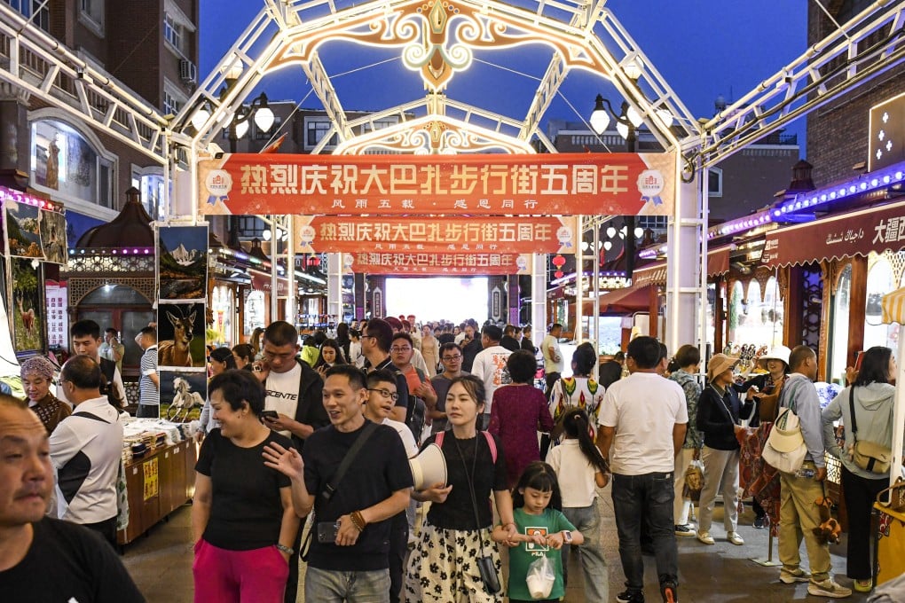 Visitors at the Xinjiang International Grand Bazaar in Urumqi. Photo: Xinhua