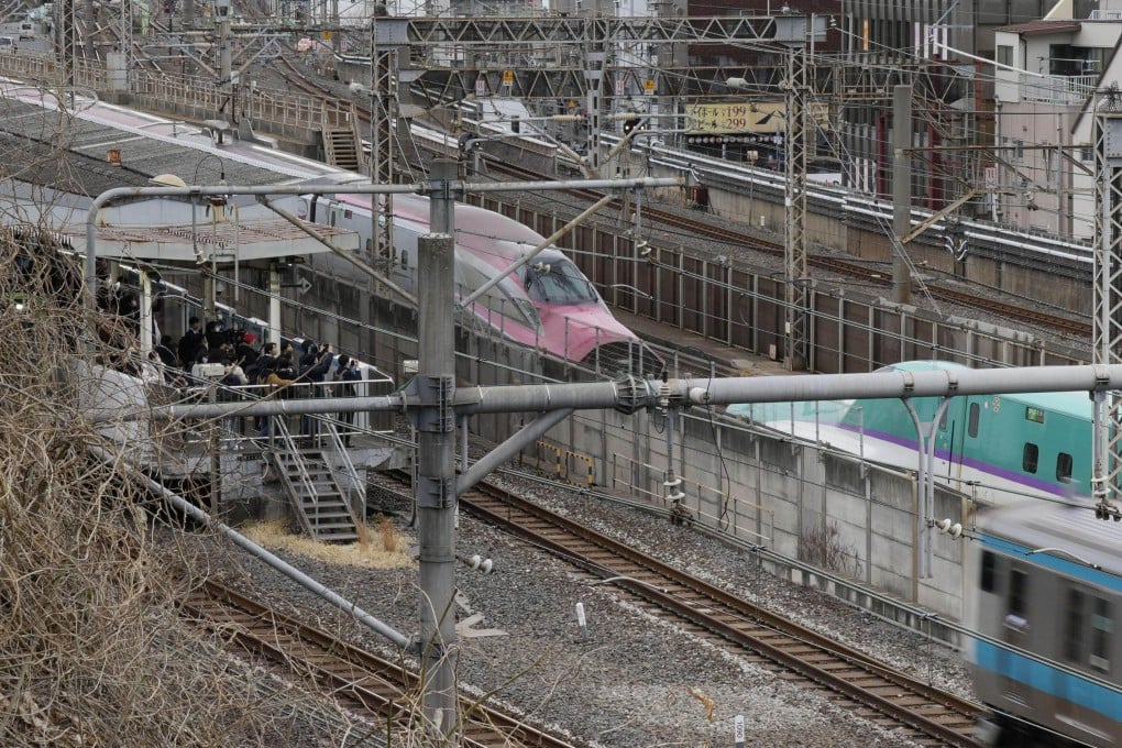 A bullet train on the Tohoku Shinkansen Line makes an emergency stop near JR Nishi-Nippori Station in Tokyo after two cars decoupled. The incident led to a suspension of bullet train services in eastern Japan. Photo: Kyodo