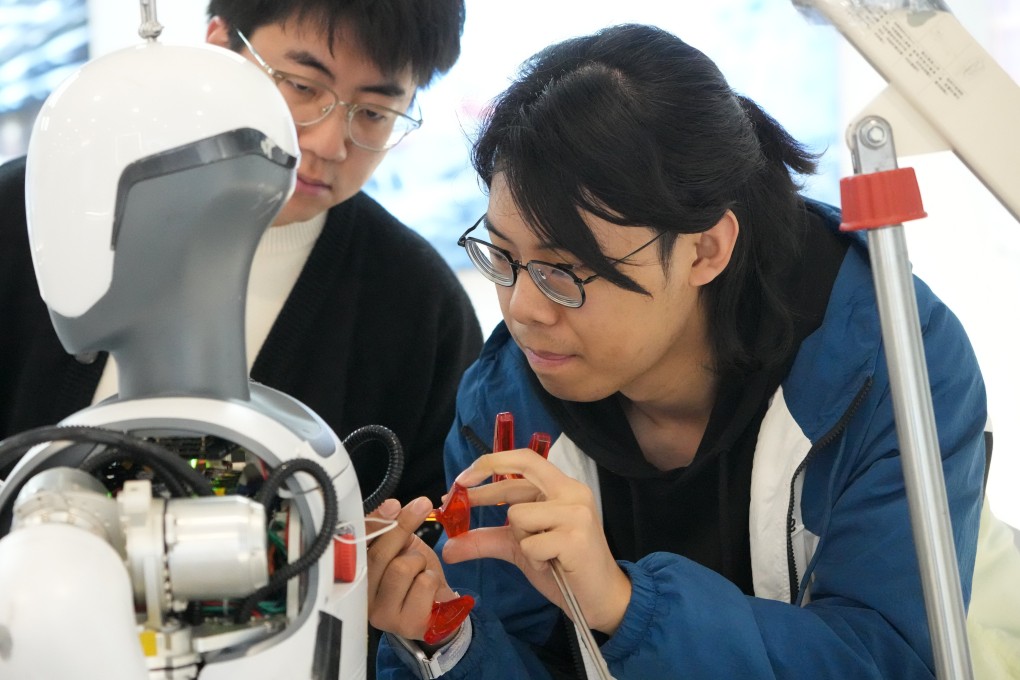 Tech workers debug a humanoid robot at a robotics firm in Hangzhou, Zhejiang province, on February 28. Photo: Xinhua