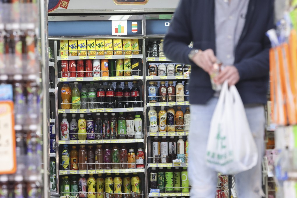 People buy drinks at convenience store in Tsim Sha Tsui on February 18. Photo: Jelly Tse