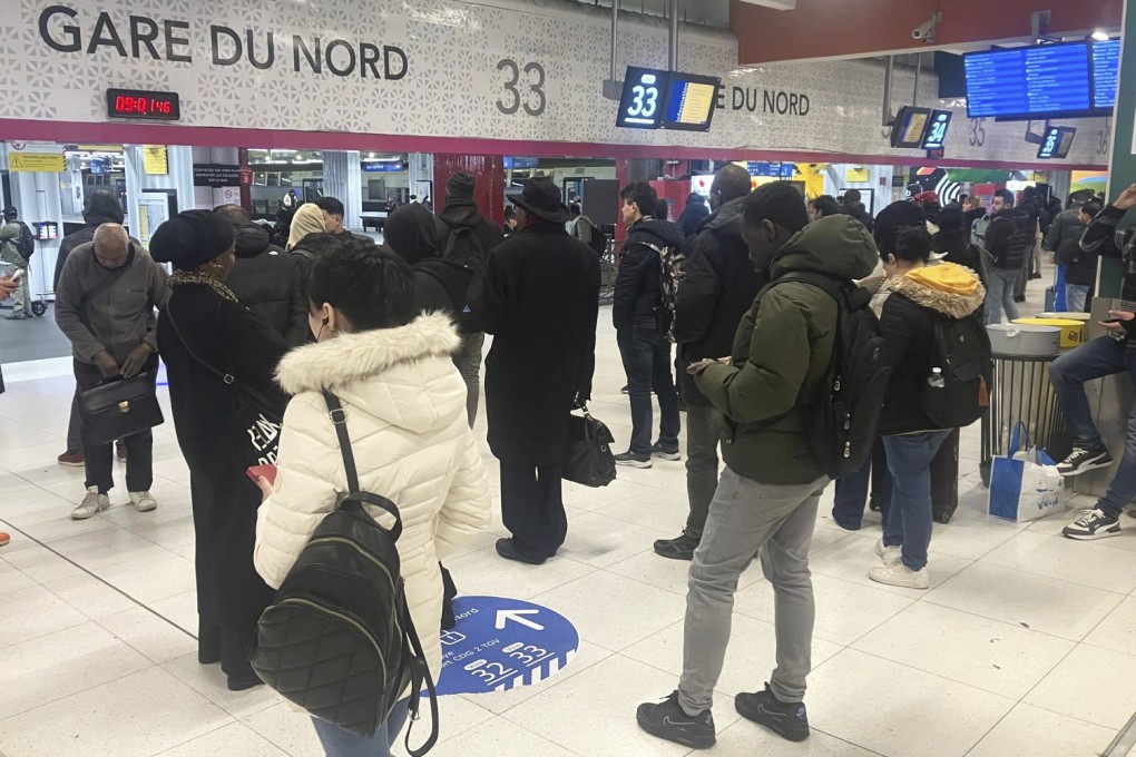 Passengers wait as Eurostar trains to London and all trains heading to northern France have been brought to a halt following the discovery of an unexploded bomb dating back to World War II near the tracks, on March 7, 2025 at the Gare du Nord station in Paris. Photo: AP