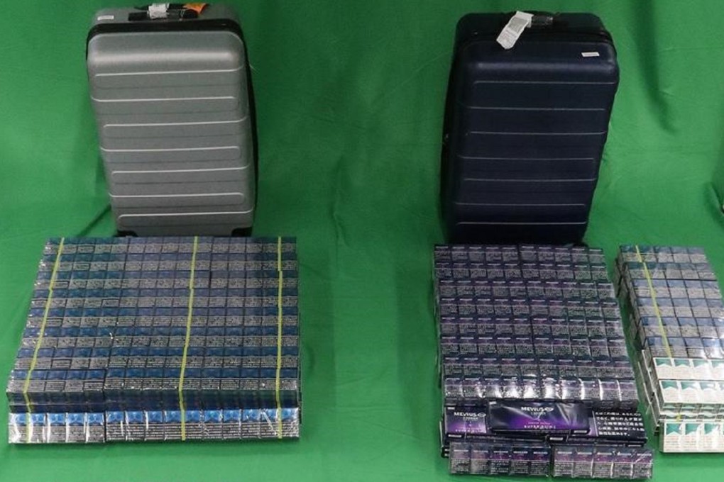 Cigarettes the passenger was caught carrying are displayed by customs. Photo: SMCP