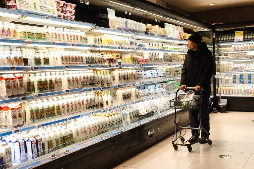 A shopper at a food store in Beijing last month. Photo: EPA-EFE
