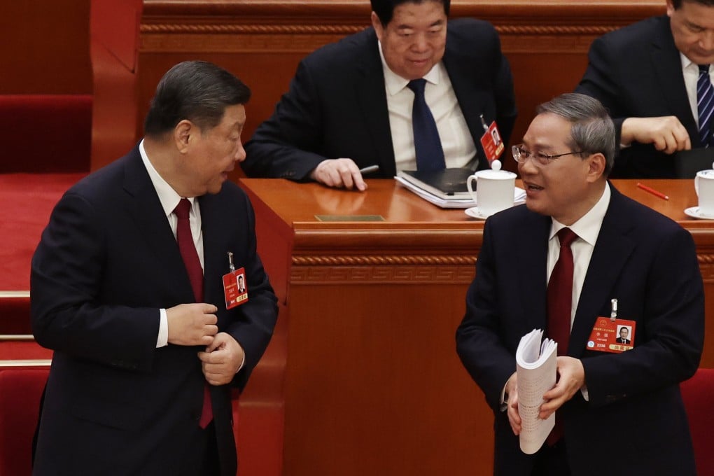 Chinese President Xi Jinping speaks to Premier Li Qiang at the opening ceremony of the third session of the 14th National People’s Congress, at the Great Hall of the People in Beijing, on March 5. Photo: EPA-EFE