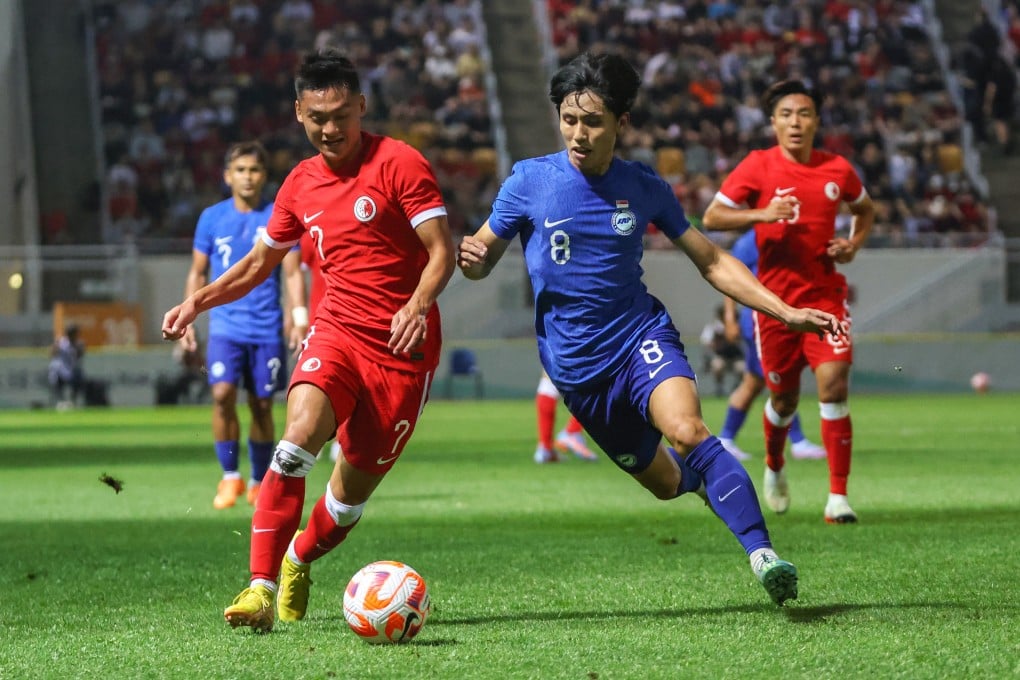Hong Kong’s Law Tsz-chun (left) and Singapore’s Glenn Kweh vie for the ball in a 2023 friendly match. Photo: Edmond So