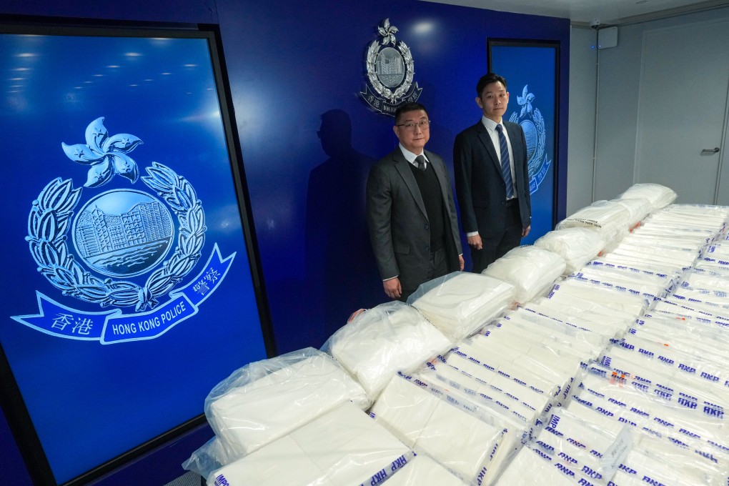 Chief Superintendent Ng Kwok-cheung and (left) Senior Inspector Tong Wai-kwok display a recent haul of about 520 kilograms of suspected cocaine at police headquarters in Wan Chai. Photo: Sam Tsang