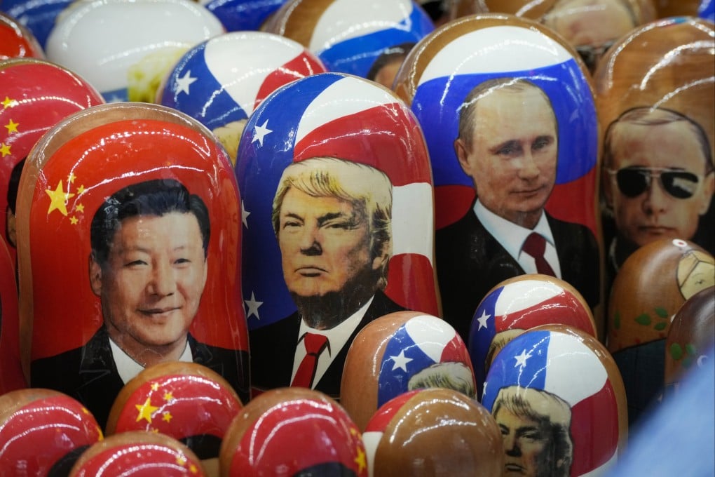 Traditional wooden dolls depicting (from left) Chinese President Xi Jinping, US President Donald Trump and Russian President Vladimir Putin are displayed for sale at a souvenir shop in St Petersburg, Russia in November. Photo: AP