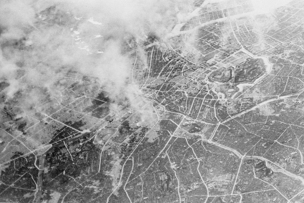 Smoke rises near the Japanese Imperial Palace (right, centre) several hours after Tokyo was bombed by more than 300 B-29s on March 10, 1945. Photo: US Air Force/AP
