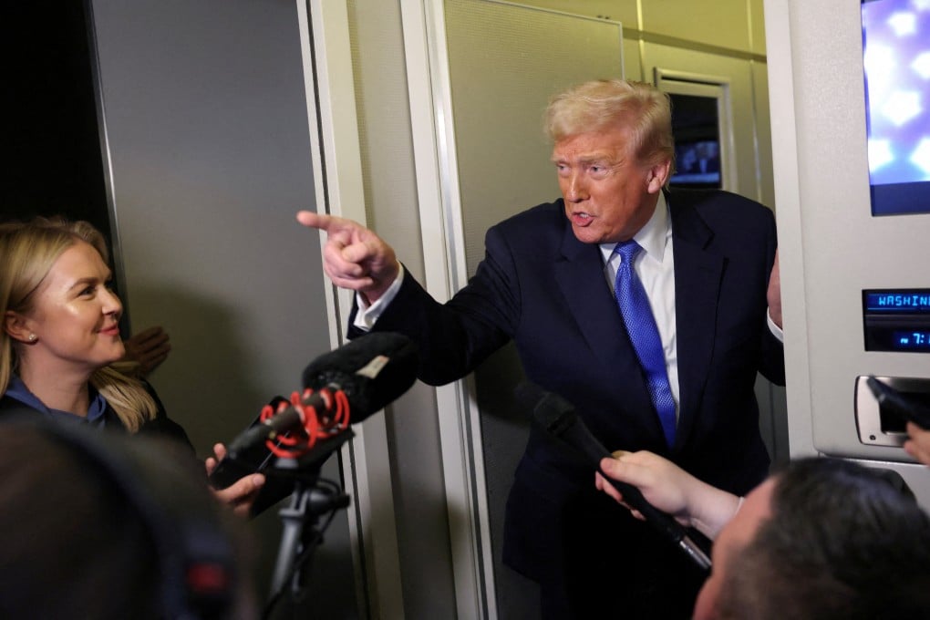 US President Donald Trump speaks to reporters aboard Air Force One. Photo: Reuters