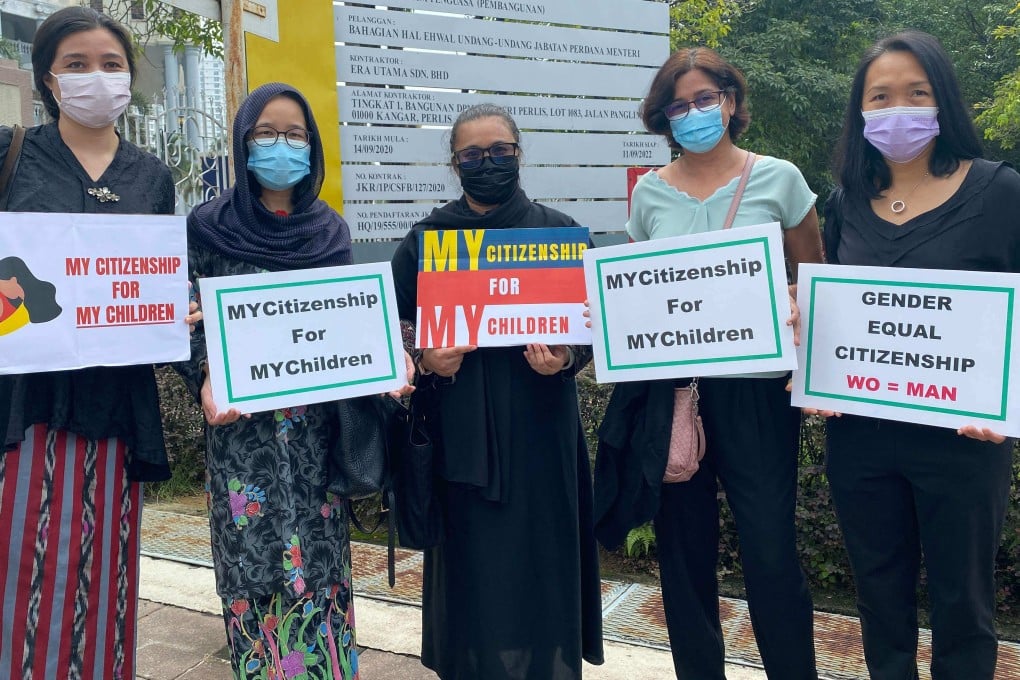 Plaintiffs in a case challenging a law preventing Malaysian women passing their citizenship on to overseas-born children outside the Kuala Lumpur High Court. Photo: AFP/Family Frontiers