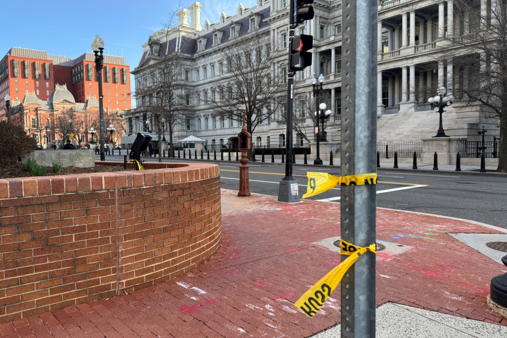 Police tape remains at the scene of an overnight shooting on a street bordering the White House complex in Washington on Sunday. Photo: Reuters
