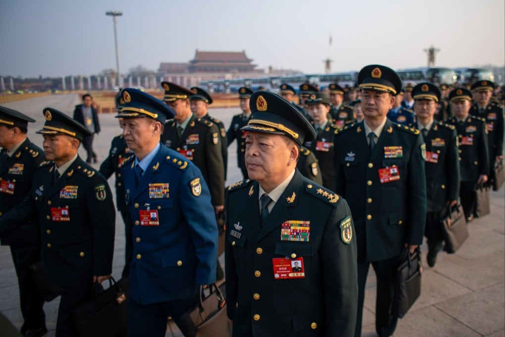 Military delegates arrive to attend a plenary meeting during China’s annual “two sessions”, in Beijing on Monday. Photo: EPA-EFE