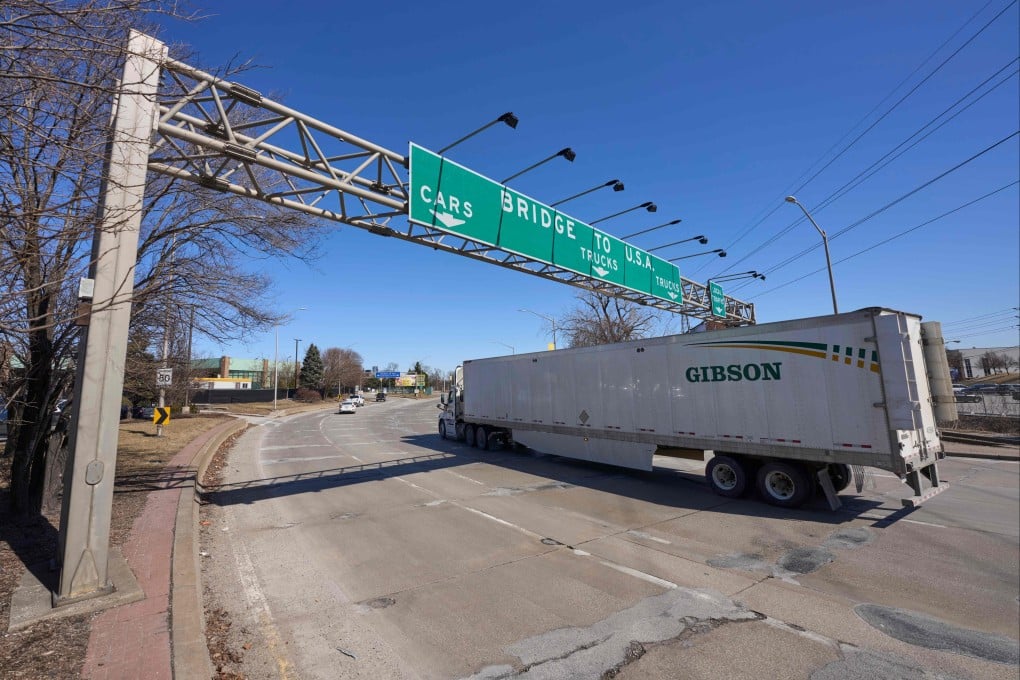 Trucks prepare to cross the US-Canada border at the Ambassador Bridge in Ontario. Photo: AFP
