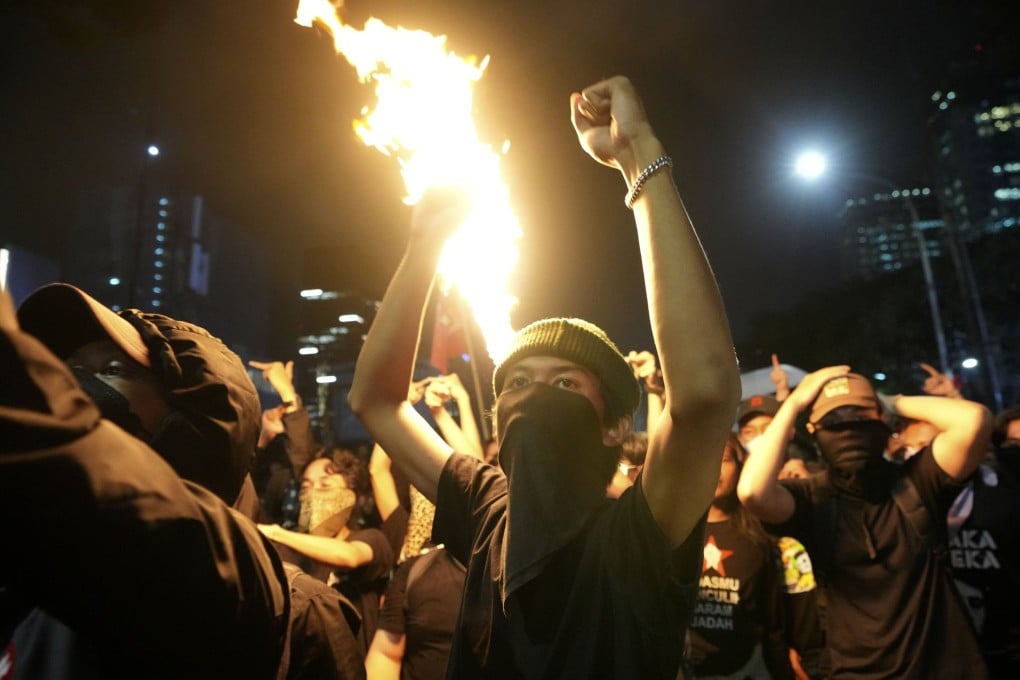 A student protester raises his fists as young Indonesians hold a rally in Jakarta last month against President Prabowo Subianto’s budget cuts. Photo: AP