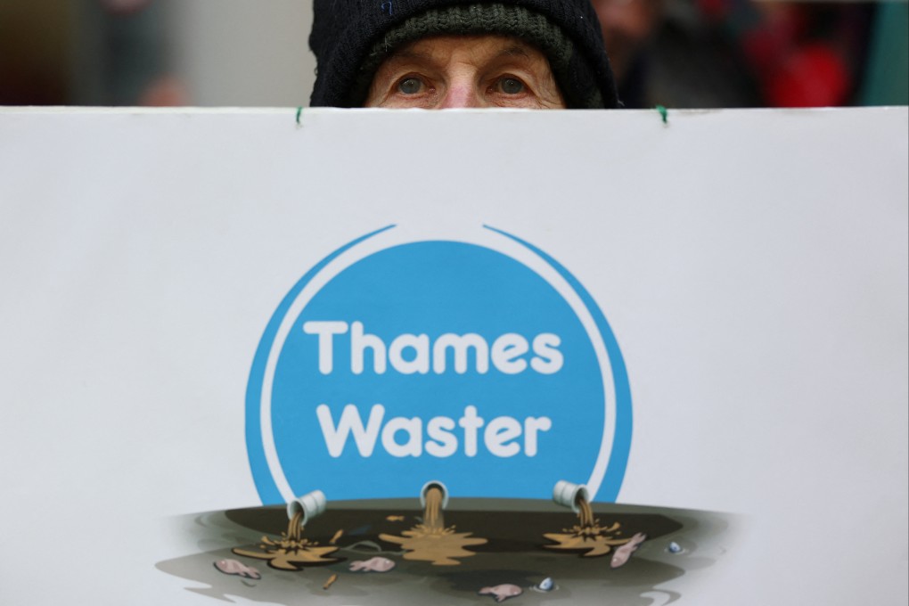 A protester holds a placard during a demonstration opposing court approval for Thames Water’s debt restructuring plan in London. Photo: Reuters