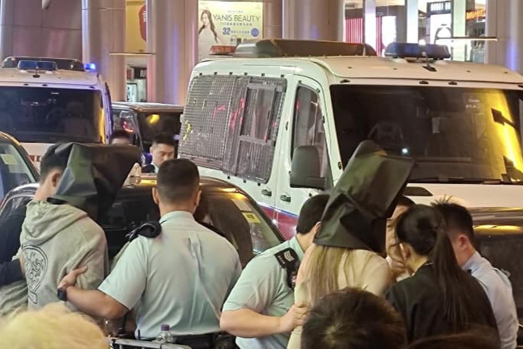 The man and woman in the car were arrested by police officers. Photo: Handout