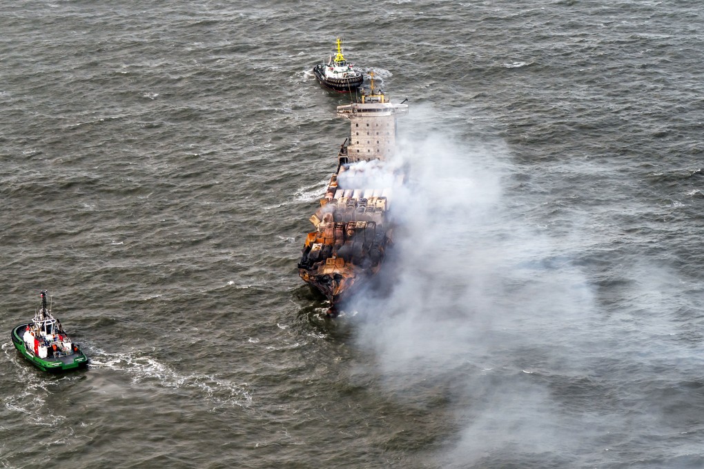 Tug boats shadow the Solong container ship on Tuesday as it drifts in the Humber Estuary, off the coast of East Yorkshire, following a collision with the MV Stena Immaculate oil tanker. Photo: PA Wire via dpa