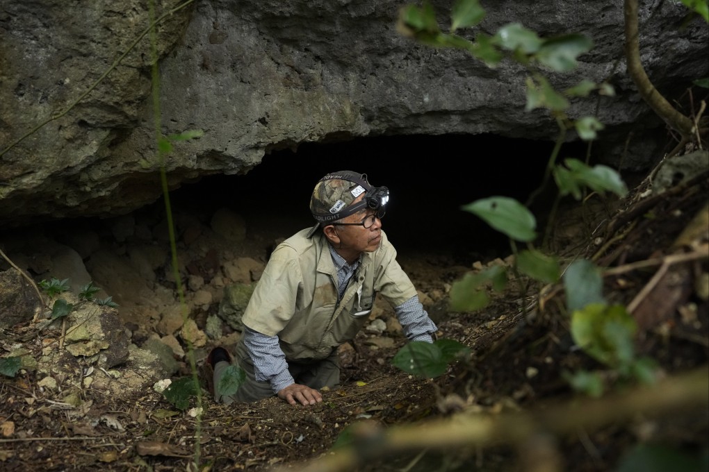 Gushiken Takamatsu leaves a cave after searching for the remains of those who died during the Battle of Okinawa in Itoman, southern Japan. Photo: AP