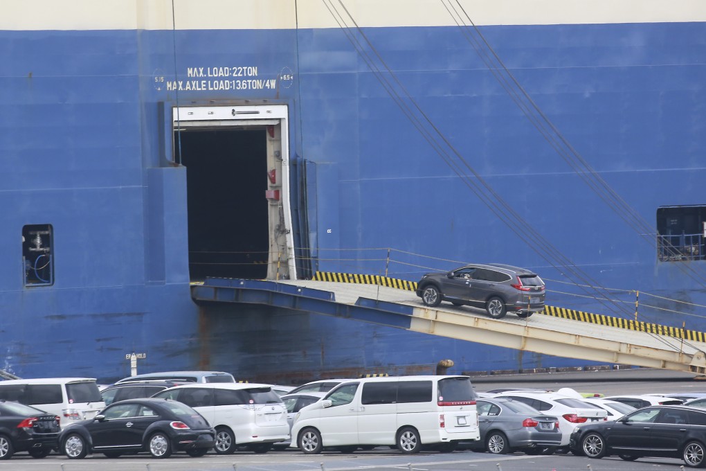 Cars for export are loaded onto a cargo ship at a port in Yokohama, near Tokyo. Thirty per cent of all Japanese shipments to the US are in the auto sector. Photo: AP