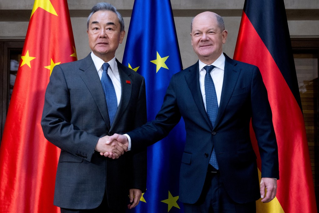 German Chancellor Olaf Scholz, right, and Foreign Minister Wang Yi shake hands at the Munich Security Conference in Munich, Germany, on February 15. Photo: Reuters