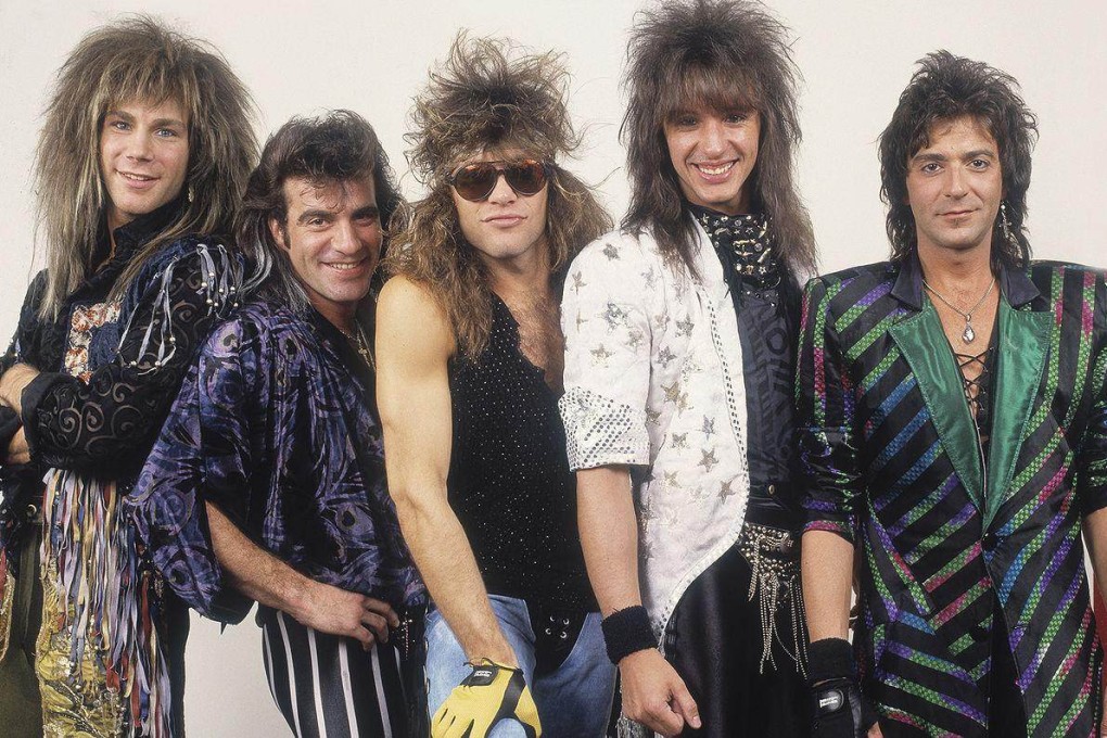 Members of Bon Jovi in the late 1980s, around the time of the original release of the album Slippery When Wet, with Jon Bon Jovi in the centre.