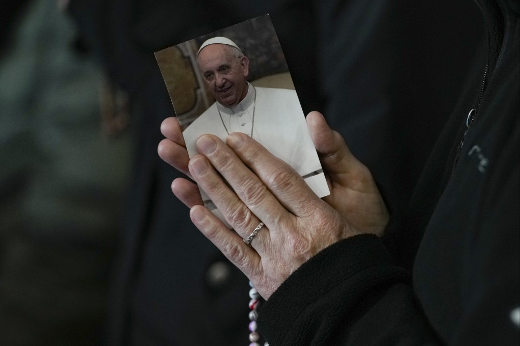 A nun prays for Pope Francis, in St Peter’s Square at the Vatican. Photo: AP