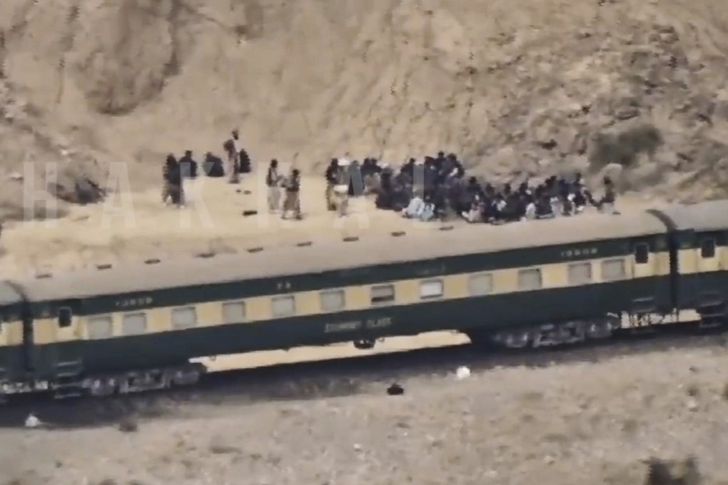 Footage released by the Baluchistan Liberation Army shows people outside the train after being attacked by militants on the way from Quetta to Peshawar. Photo: BLA via AP
