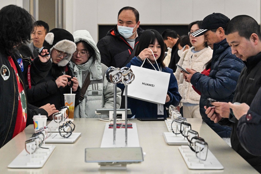 Customers shop in a Huawei store in Huangpu district in Shanghai on February 20. China has four key ingredients for technological supremacy, including a large market of consumers with insatiable appetites for innovative products. Photo: AFP