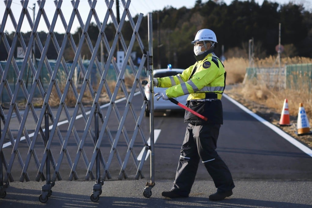 Futaba is seen behind a retractable fence. Photo: Kyodo