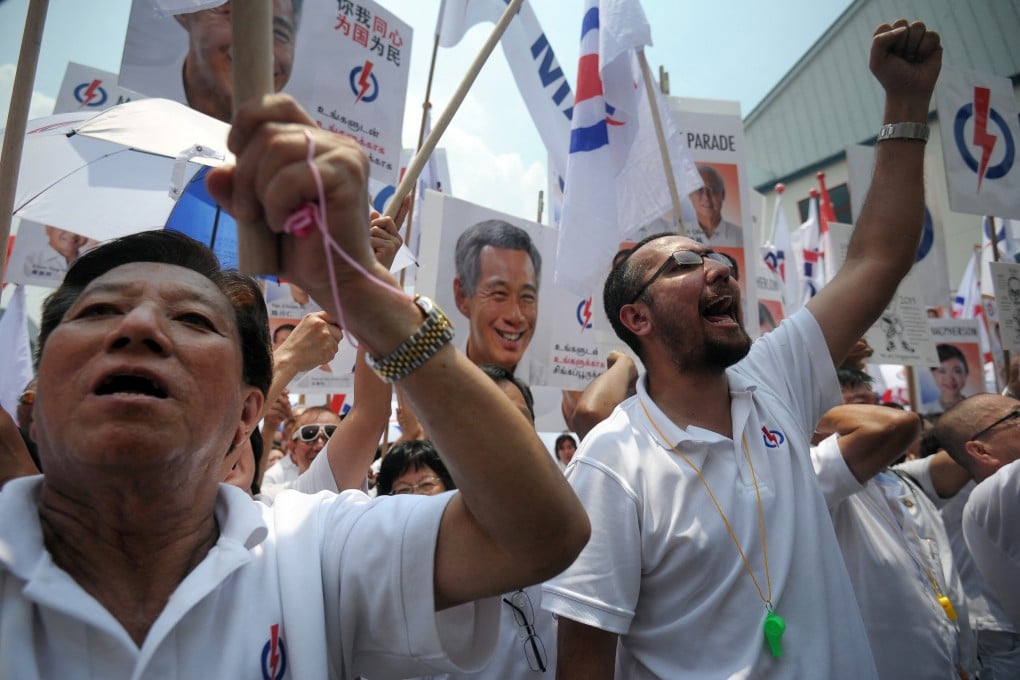 Supporters of Singapore’s ruling People’s Action Party display party flags and posters ahead of a general election in 2015. Photo: AFP