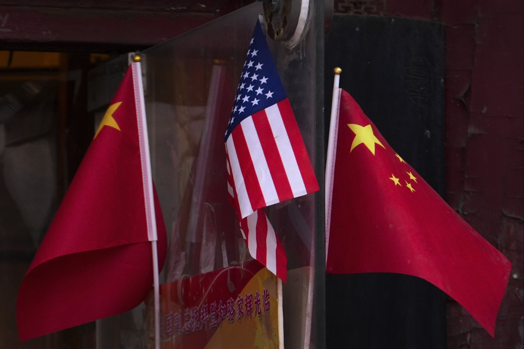 China and US national flags fly outside a souvenir shop in Beijing on January 31. Photo: AP