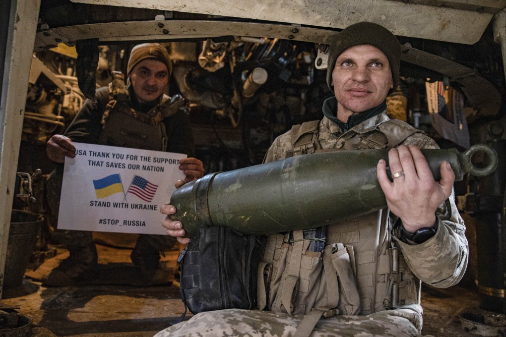 Soldiers of Ukraine’s 5th brigade hold a poster thanking the US for support during a flashmob on the front line near Toretsk, Donetsk region, Ukraine, on March 11. Photo: AP