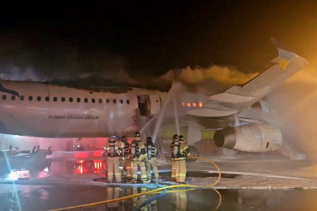 Firefighters try to put out the blaze from an Air Busan plane at Gimhae International Airport in South Korea on January 28. Photo: Yonhap/Reuters